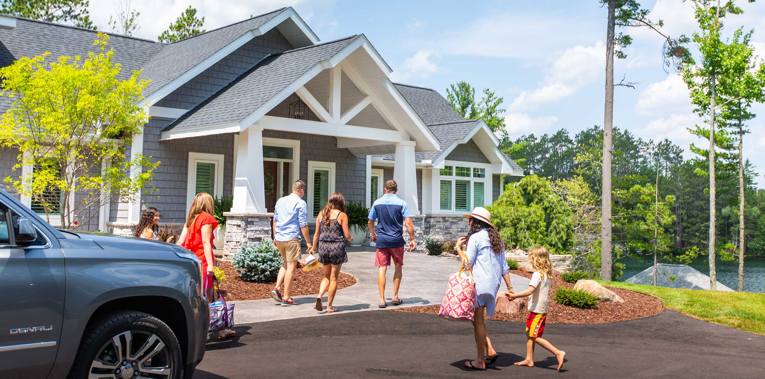family entering beautiful northern michigan cottage